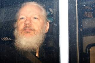 WikiLeaks founder Julian Assange is seen in a police van, after he was arrested by British police, in London, Britain April 11, 2019. REUTERS/Henry Nicholls