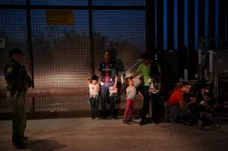 Migrant families from Honduras turn themselves to U.S. Border Patrol to seek asylum following an illegal crossing of the Rio Grande in Hidalgo, Texas, U.S., August 23, 2019. Picture taken August 23, 2019. REUTERS/Loren Elliott 