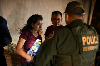 Thirteen year-old Joseline, a Guatemalan migrant seeking asylum with father Jose Luis, cries after crossing the Rio Grande and turning herself in to U.S. Border Patrol in Hidalgo, Texas, U.S., August 23, 2019. Picture taken August 23, 2019. REUTERS/Loren 