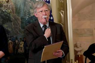 FILE PHOTO: National Security Adviser John Bolton listens to U.S. President Donald Trump's statement on Syria at the White House in Washington, U.S., April 13, 2018. Picture taken April 13, 2018. REUTERS/Yuri Gripas/File Photo