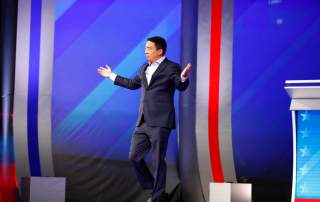 Entrepreneur Andrew Yang takes the stage for the start of the 2020 Democratic U.S. presidential debate in Houston, Texas, U.S., September 12, 2019. REUTERS/Jonathan Bachman