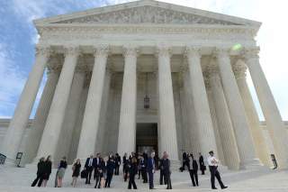 FILE PHOTO: People leave the Supreme Court after it resumed hearing oral arguments at the start of its new term in Washington, U.S., October 7, 2019. REUTERS/Mary F. Calvert/File Photo