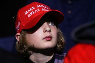 A supporter wearing a Make America Great Again (MAGA) hat attends U.S. President Donald Trump's campaign rally in Battle Creek, Michigan, U.S., December 18, 2019. REUTERS/Leah Millis?