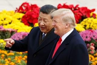 U.S. President Donald Trump and China's President Xi Jinping attend a welcoming ceremony in Beijing, China, November 9, 2017. REUTERS/Thomas Peter