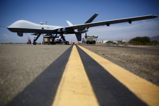 A General Atomics MQ-9 Reaper stands on the runway during 