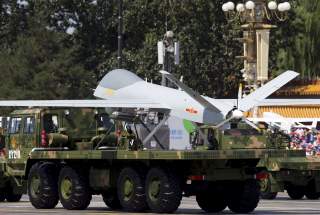 Military vehicles carrying Wing Loong, a Chinese-made medium altitude long endurance unmanned aerial vehicle, take part in a military parade to commemorate the 70th anniversary of the end of World War II in Beijing Thursday Sept. 3, 2015. REUTERS/Andy Won