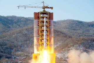 A North Korean long-range rocket is launched into the air at the Sohae rocket launch site, North Korea, in this photo released by Kyodo February 7, 2016.