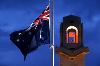 An Australian flag is flown at half mast during the dawn service to mark the ANZAC (Australian and New Zealand Army Corps) commemoration ceremony at the Australian National Memorial in Villers-Bretonneux, France, April 25, 2016. REUTERS/Pascal Rossignol