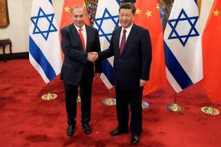 Chinese President Xi Jinping and Israeli Prime Minister Benjamin Netanyahu shake hands ahead of their talks at Diaoyutai State Guesthouse in Beijing, China March 21, 2017. REUTERS/Etienne Oliveau/Pool TPX IMAGES OF THE DAY *** Local Caption *** Xi Jinping