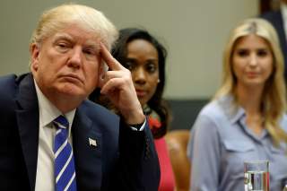 U.S. President Donald Trump (L), flanked by Johnson Security Bureau President Jessica Johnson and his daughter Ivanka Trump, meets with women small business owners at the White House in Washington, U.S. March 27, 2017. REUTERS/Jonathan Ernst TPX IMAGES OF