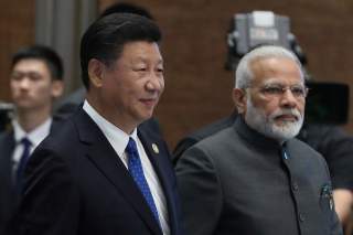 Chinese President Xi Jinping (L) and Indian Prime Minister Narendra Modi, arrive for the 'Dialogue of Emerging Market and Developing Countries' on the sidelines of the 2017 BRICS Summit in Xiamen, Fujian province, China, 05 September 2017. REUTERS/Wu Hong