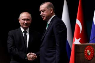 Turkish President Tayyip Erdogan shakes hands with Russian President Vladimir Putin after a news conference in Ankara, Turkey, December 11, 2017. REUTERS/Umit Bektas