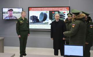 Russian President Vladimir Putin (2nd L) visits the Military Academy of the Strategic Missile Forces, named after Peter the Great, outside Moscow, Russia December 22, 2017. Sputnik/Mikhail Klimentyev/Sputnik via REUTERS ATTENTION EDITORS - THIS IMAGE WAS 