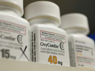 Bottles of prescription painkiller OxyContin made by Purdue Pharma LP sit on a shelf at a local pharmacy in Provo, Utah, U.S., April 25, 2017. REUTERS/George Frey