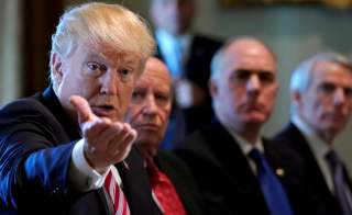 U.S. President Donald Trump holds a meeting on trade with members of Congress at the White House in Washington, U.S., February 13, 2018. REUTERS/Kevin Lamarque