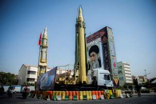 FILE PHOTO: A display featuring missiles and a portrait of Iran's Supreme Leader Ayatollah Ali Khamenei is seen at Baharestan Square in Tehran, Iran September 27, 2017. Picture taken September 27, 2017. Nazanin Tabatabaee Yazdi/TIMA via REUTERS ATTENTION 