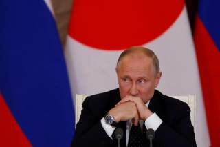 Russian President Vladimir Putin attends a joint news conference with Japanese Prime Minister Shinzo Abe following their meeting at the Kremlin in Moscow, Russia May 26, 2018