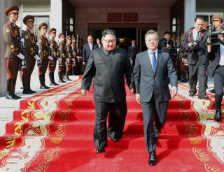 South Korean President Moon Jae-in and North Korean leader Kim Jong Un leave after their summit at the truce village of Panmunjom, North Korea, in this handout picture provided by the Presidential Blue House on May 26, 2018. Picture taken on May 26, 2018.