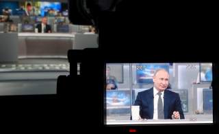 Russian President Vladimir Putin is seen on a video camera screen as he attends a live nationwide broadcast call-in in Moscow, Russia June 7, 2018. Sputnik/Mikhail Klimentyev/Kremlin via REUTERS