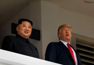 U.S. President Donald Trump and North Korea's leader Kim Jong Un hold a summit at the Capella Hotel on the resort island of Sentosa, Singapore June 12, 2018. REUTERS/Jonathan Ernst