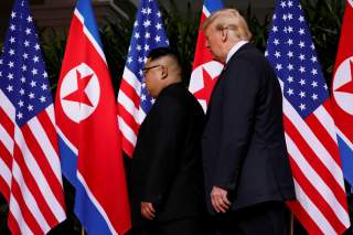 U.S. President Donald Trump and North Korea's leader Kim Jong Un hold a summit at the Capella Hotel on the resort island of Sentosa, Singapore June 12, 2018. REUTERS/Jonathan Ernst