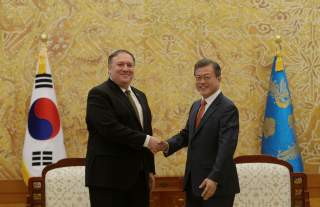 South Korean President Moon Jae-in, right, shakes hands with U.S. Secretary of State Mike Pompeo during a meeting at the presidential Blue House in Seoul, South Korea Ocober 7, 2018. Ahn Young-joon/Pool via REUTERS