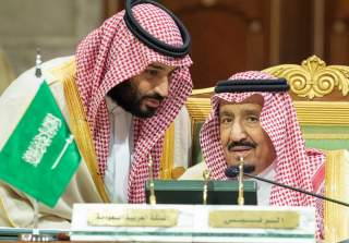 FILE PHOTO: Saudi Arabia's Crown Prince Mohammed bin Salman talks with Saudi Arabia's King Salman bin Abdulaziz Al Saud during the Gulf Cooperation Council's (GCC) Summit in Riyadh, Saudi Arabia Dec. 9, 2018. Bandar Algaloud/Courtesy of Saudi Royal Court/