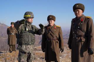 Soldiers from North and South Korea verify the removal of guard posts on each side of the Demilitarized Zone, December 12, 2018. South Korean Defence Ministry/Handout via REUTERS THIS IMAGE HAS BEEN SUPPLIED BY A THIRD PARTY.