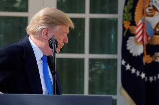 U.S. President Donald Trump leaves the podium and heads back to the Oval Office after declaring a national emergency at the U.S.-Mexico border during remarks about border security in the Rose Garden of the White House in Washington, U.S., February 15, 201