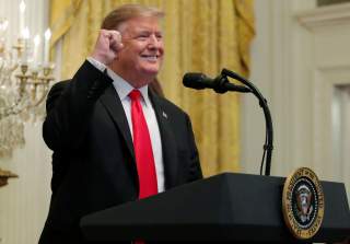 U.S. President Donald Trump reacts as he hosts a reception in honor of National African American History Month at the White House in Washington, U.S., February 21, 2019. REUTERS/Jim Young