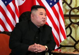 North Korean leader Kim Jong Un listens as U.S. President Donald Trump speaks during the one-on-one bilateral meeting at the second North Korea-U.S. summit in Hanoi, Vietnam February 28, 2019. REUTERS/Leah Millis