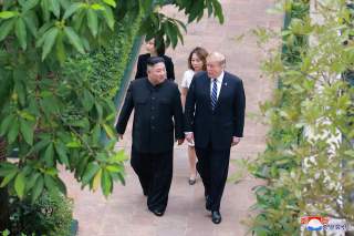 North Korea's leader Kim Jong Un walks with U.S. President Donald Trump during the second North Korea-U.S. summit in Hanoi, Vietnam, in this photo released on March 1, 2019 by North Korea's Korean Central News Agency (KCNA). KCNA via REUTERS ATTENTION EDI