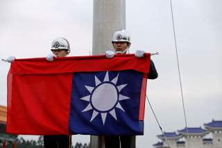 Military honour guards attend a flag-lowering ceremony at Chiang Kai-shek Memorial Hall in Taipei, Taiwan January 22, 2019. Picture taken January 22, 2019. REUTERS/Tyrone Siu