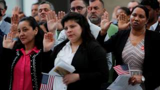 Immigrants take the Oath of Allegiance to become a U.S. citizens during an official Naturalization Ceremony at the Museum of Fine Arts, Boston in Boston, Massachusetts, U.S., May 6, 2019. REUTERS/Brian Snyder