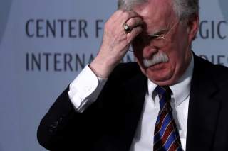 White House former National Security Advisor John Bolton fixes his hair and listens to a question after his remarks on North Korea at the Center for Strategic and International Studies (CSIS) think tank in Washington, U.S. September 30, 2019.