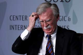 White House former National Security Advisor John Bolton fixes his hair and listens to a question after his remarks on North Korea at the Center for Strategic and International Studies (CSIS) think tank in Washington, U.S. September 30, 2019.