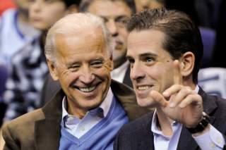 U.S. Vice President Joe Biden and his son Hunter Biden attend an NCAA basketball game between Georgetown University and Duke University in Washington, U.S., January 30, 2010. Picture taken January 30, 2010. REUTERS/Jonathan Ernst