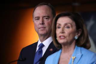 U.S. House Speaker Nancy Pelosi (D-CA) addresses reporters as House Intelligence Committee Chairman Adam Schiff (D-CA) looks on during Pelosi's weekly news conference at the U.S. Capitol in Washington, U.S., October 2, 2019. REUTERS/Jonathan Ernst