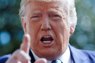 U.S. President Donald Trump talks to reporters as he heads to the Marine One helicopter to fly from the South Lawn to visit injured members of the U.S. military at Walter Reed National Military Medical Center from the White House.