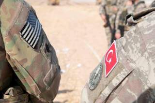 U.S. and Turkish military forces conduct a joint ground patrol inside the security mechanism area in northeast, Syria, October 4, 2019. Picture taken October 4, 2019. U.S. Army/Staff Sgt. Andrew Goedl/Handout via REUTERS.