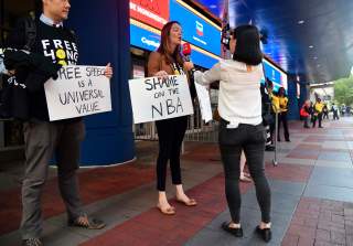 Oct 9, 2019; Washington, DC, USA; Activists hold signs in support of Hong Kong before the game between the Washington Wizards and the Guangzhou Loong-Lions at Capital One Arena. Mandatory Credit: Brad Mills-USA TODAY Sports