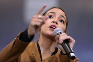 Rep. Alexandria Ocasio-Cortez talks before Democratic 2020 U.S. presidential candidate Senator Bernie Sanders at a rally in Council Bluffs, Iowa, U.S. November 8, 2019. REUTERS/Scott Morgan