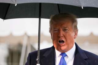 U.S. President Donald Trump speaks to reporters as he and first lady Melania Trump depart for travel to a NATO summit in London, from the White House in Washington, U.S. December 2, 2019. REUTERS/Jonathan Ernst