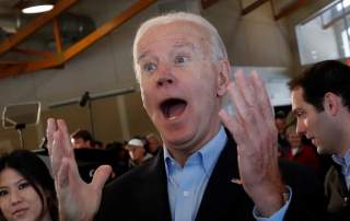 Democratic 2020 U.S. presidential candidate and former U.S. Vice President Joe Biden reacts to a girl during his 