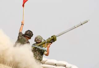 Macedonian soldiers fire an anti-aircraft missile with the Russian-made Igla ground-to-air launcher, supervised by a Slovenian military instructor, during a live fire exercise on September 12, 2008 at the Krivolak training ground, some 120 km (75 miles) s