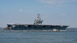 The U.S. Navy aircraft carrier USS Harry S. Truman departs with its strike group towards the Middle East from Naval Station Norfolk, Virginia, U.S. April 11, 2018. U.S. Navy/Mass Communication Specialist 3rd Class Danny Ray Nunez Jr./Handout via REUTERS