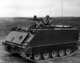 M113 firing .50-caliber machine gun during South Vietnamese training exercise. Barrel of side-mounted .30-caliber machine gun can be seen on far side of M113.