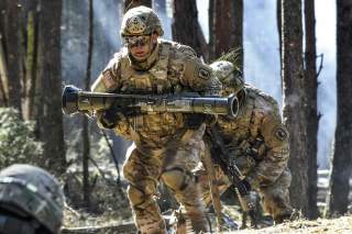 A U.S. Army Paratrooper with 2nd Battalion, 503rd Infantry Regiment, 173rd Airborne Brigade carries a AT-4 training grenade launcher    during a platoon level live fire exercise at the 7th Army Training Command’s Grafenwoehr Training Area, Germany, March 