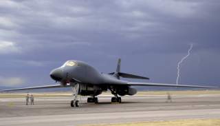 ELLSWORTH AIR FORCE BASE, S.D. - Lightning strikes behind a B-1B Lancer during an evening thunderstorm, Sept. 9. The 28th Bomb Wing maintains a fleet of 28 B-1s.