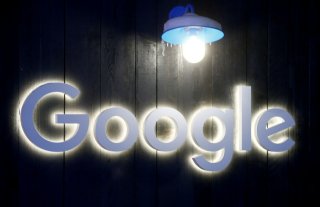 FILE PHOTO: The logo of Google is seen in Davos, Switzerland Januar 20, 2020. Picture taken January 20, 2020. REUTERS/Arnd Wiegmann/File Photo